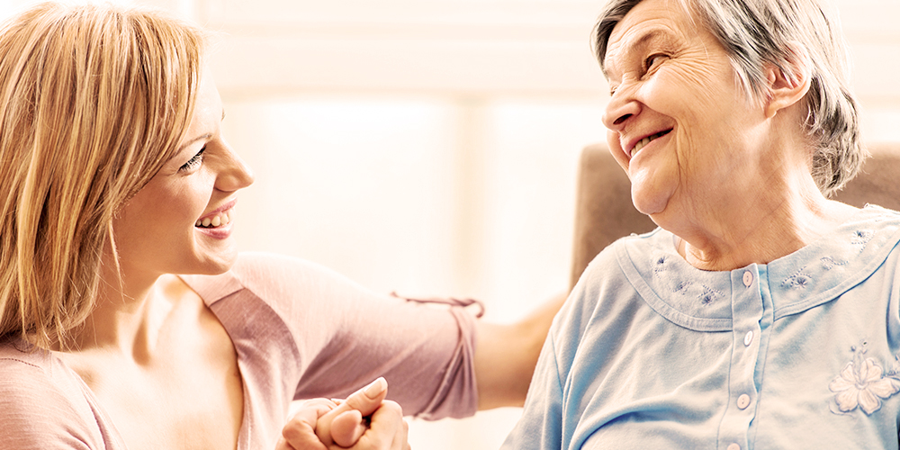 Younger woman talking with older woman Younger woman talking with older woman